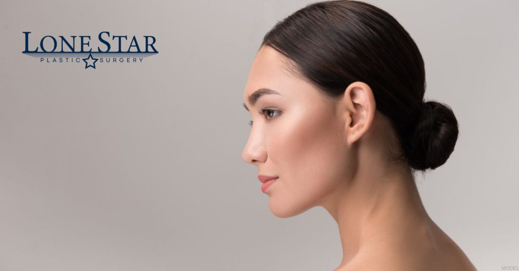 Woman showing rhinoplasty results (model)