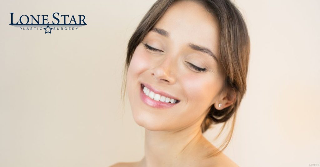 Woman showing rhinoplasty results (model)