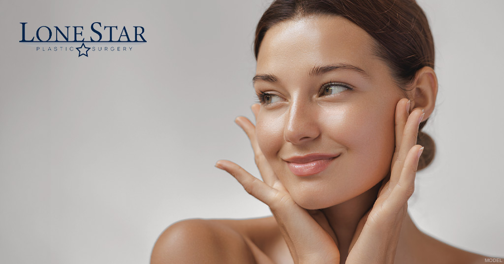 Woman (model) smiling with both hands on her face. Lone Star Plastic Surgery logo.